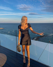 Load image into Gallery viewer, black satin dress, black mini dress, lbd, little black dress, satin puff sleeve dress, black satin dress, holiday dress